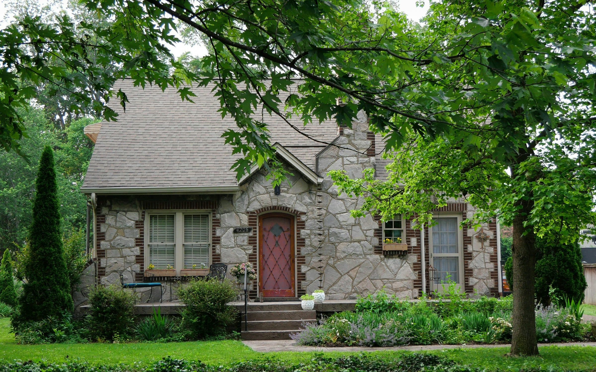 Riverstone Dental's converted residential building on 12th Avenue South, surrounded by mature trees.